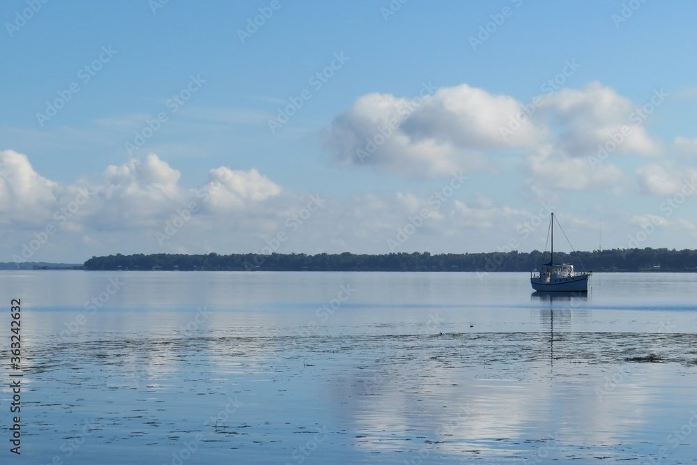 Boat on the lake on blue sky background, Florida view