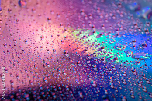 water drops on dvd media  water drops on colorful background