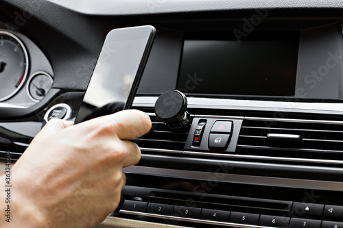 Photos Mobile phone on magnet car mount phone holder for GPS
