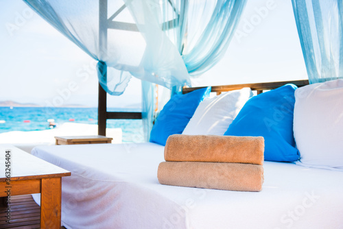 Fototapeta Naklejka Na Ścianę i Meble -  Rolled beach towels in a luxury hotel cabana