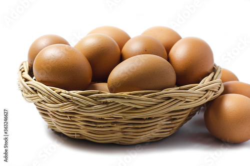 Wallpaper Mural Brown Egg Isolated on White Background. Eggs in the basket Torontodigital.ca