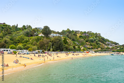 Kaiteriteri, New Zealand - Feb 2, 2020: People are enjoying the sunshine on the beach.