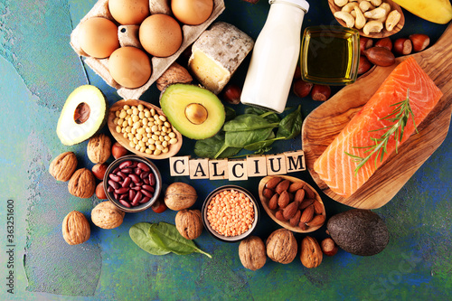 Best Calcium Rich Foods Sources. Healthy eating. Foods rich in calcium such as bean, almonds, hazelnuts, spinach leaves, cheese, and fresh milk photo