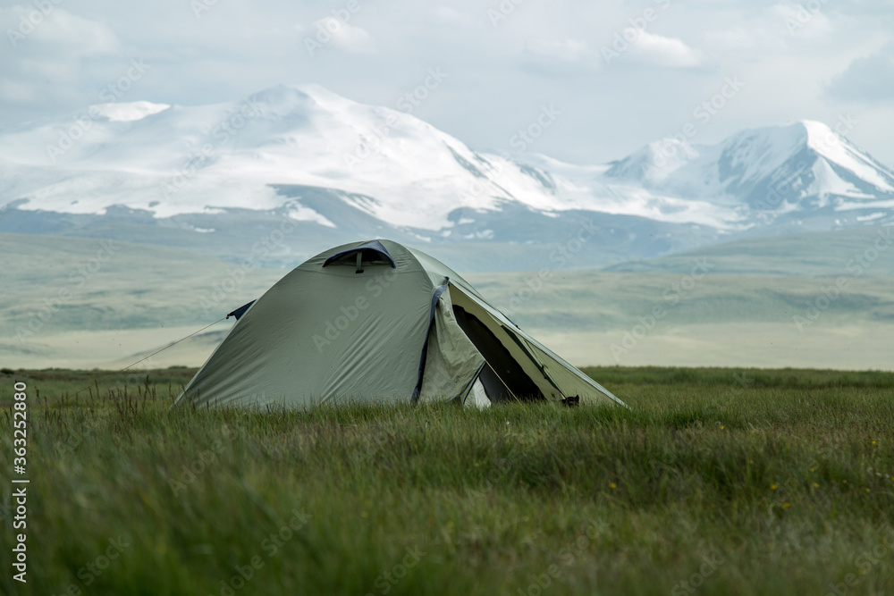 Tent at plateau Ukok. Amazing Altai. View of a mountain and steppe. Travel to Russia. Mountain hiking in the Altai republic. Active holiday with family and friends. 