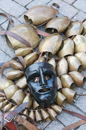 Mask, bells of mamuthone, isohadore from Sardinia, Italy. Ethnic clothes, costumes at Moscow Maslenitsa Festival. Traditional national celebration in folk style. Performance with Sardinian masked mans photo