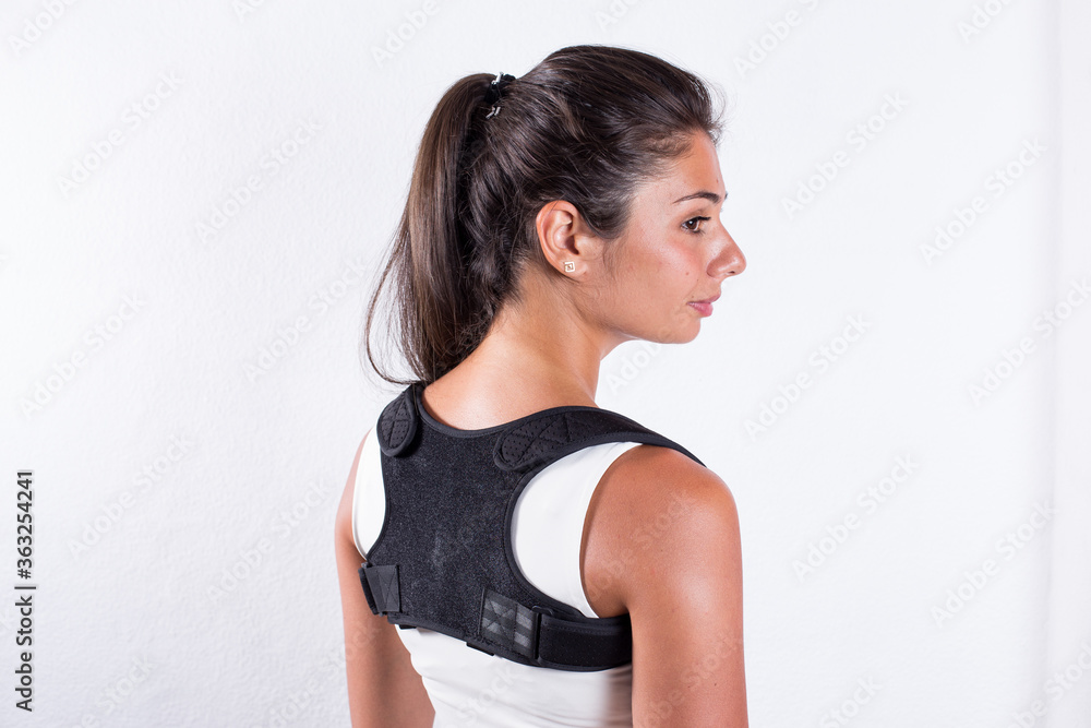 Instruction how to wear posture corrector. Different angels. Women wearing back support belt for support and improve posture consists of two parts for the back and lower back. Details, quality Instruction how to wear posture corrector. Different angels. Women wearing back support belt for support and improve posture consists of two parts for the back and lower back. Details, quality