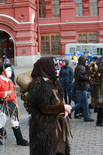 Moscow Maslenitsa Festival 2020. Traditional national celebration in folk style. Performance with Sardinian masked artists. Mamuthones and Isohadores from Sardinia, Italy. Ethnic clothes and costumes photo