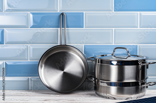 Set of aluminum cookware on kitchen counter