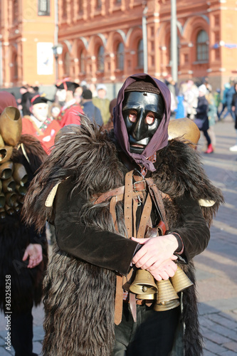 Moscow Maslenitsa Festival 2020. Traditional national celebration in folk style. Performance with Sardinian masked artists. Mamuthones and Isohadores from Sardinia, Italy. Ethnic clothes and costumes photo