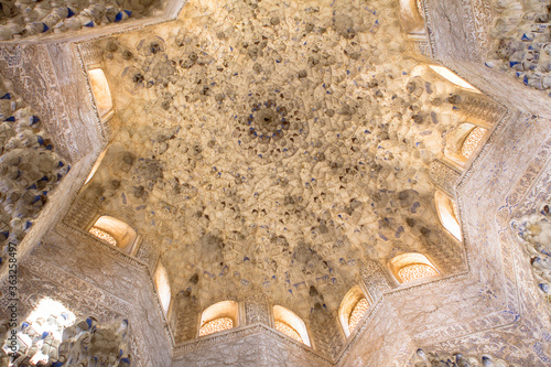 Ornate ceiling carvings of the Lions  patio in Alhambra palace Granada, Spain
