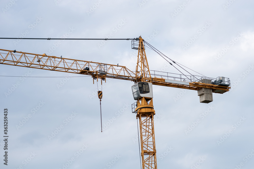 crane in the city in cloudy weather. crane in the city in cloudy weather.