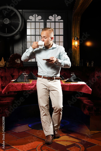 handsome man enjoying with coffee in restaurant 