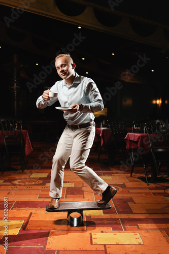 circus performer drink coffee in restaurant