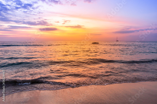 Fototapeta Naklejka Na Ścianę i Meble -  Sunset on beautiful beach, evening outdoor day light, relaxing by the peaceful beach
