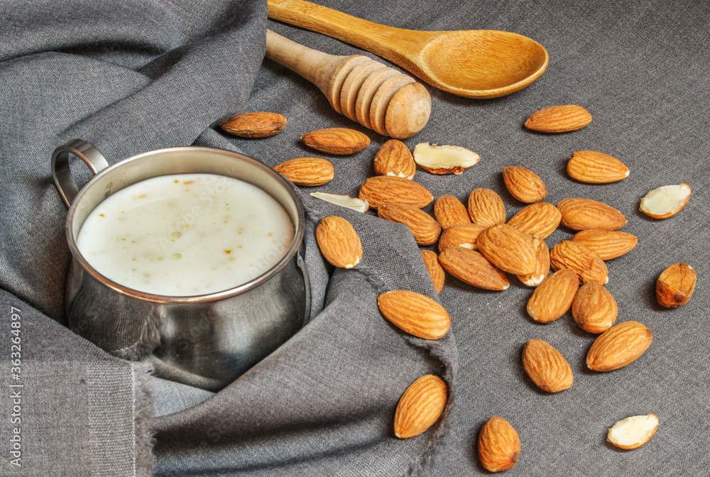 Almond milk surrounded by almonds Almond milk surrounded by almonds