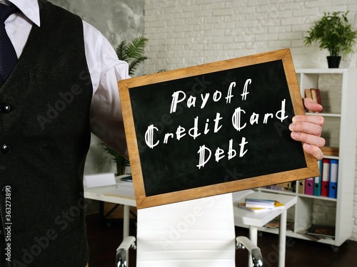 Fényképezés Business concept meaning Payoff Credit Card Debt with phrase on the sheet