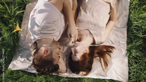 Young husband and wife relax together in the garden