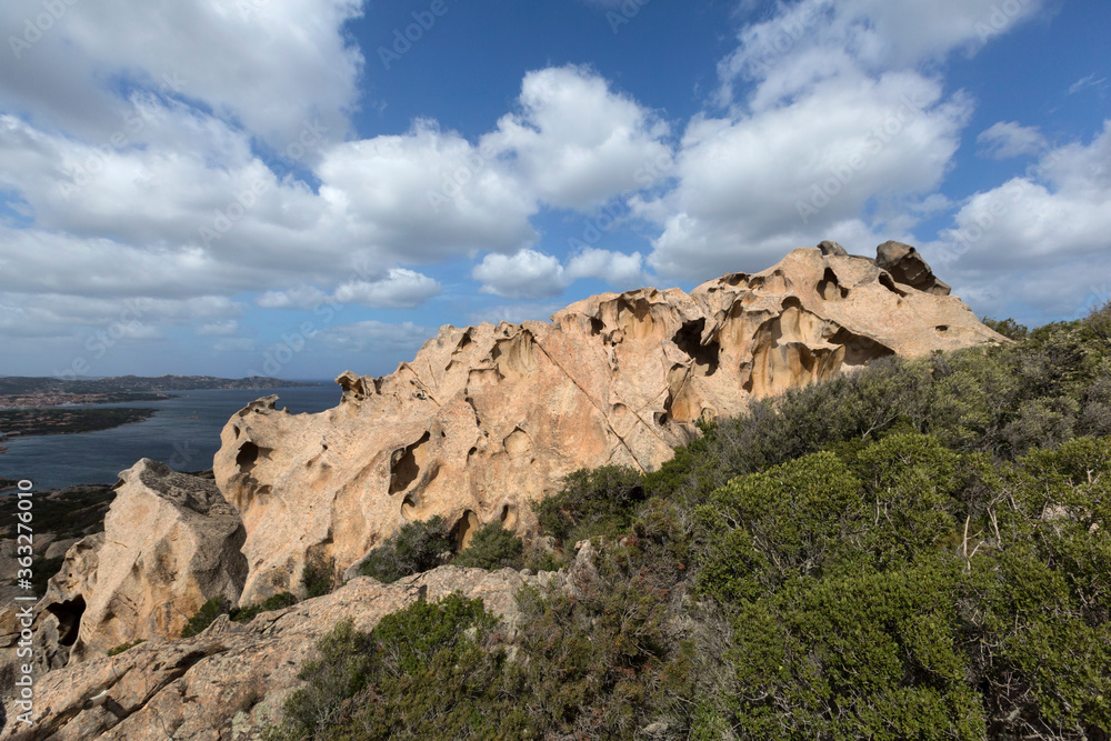 View of the sea and the city of Palau through the bear's rock during a sunny day, north of Sardinia, Italy. 