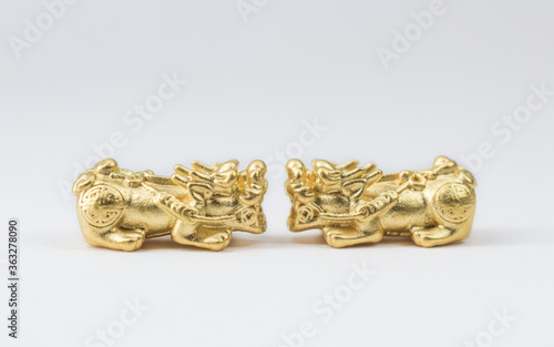 golden pixiu isolated on white. Pi xiu that made with 99.99% of gold.