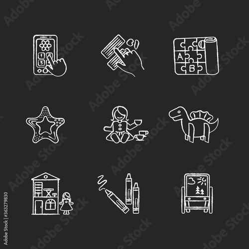 Toddler toys chalk white icons set on black background. Pretend telephone and foldable alphabet playmat. Folding tripod stand. Animal toy. Isolated vector chalkboard illustrations