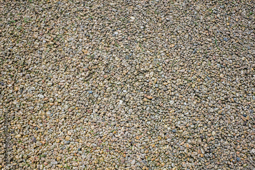 Closeup view of colored resin bound and bonded gravels laid for outdoor flooring.