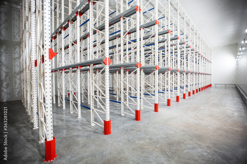 Warehouse Cantilever Racking Systems for storage Aluminum Pipe or profiles. Pallet Rack and Industrial Warehouse Racking. Steel profiles. Interior of Empty Big Huge Warehouse.