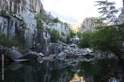small natural lake inside a marble quarry