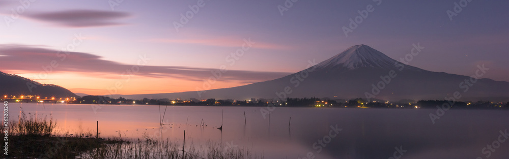 Fototapeta premium web banner night scape before sunrise from mountain fuji at kawaguchiko lake japan with soft focus foreground