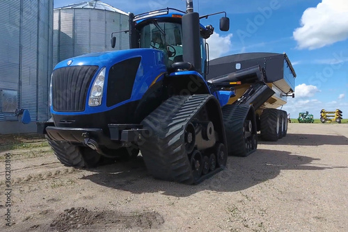 tracked tractor with rubber tires blue for industrial and agriculture transport use