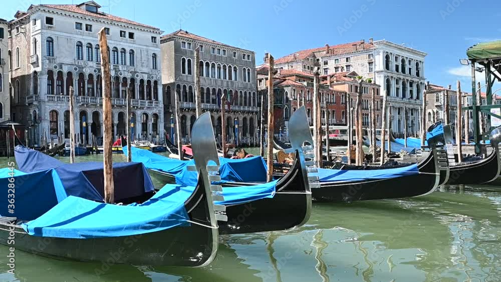 Venice, Italy - gondolas and gondoliers in the Grand Canal near the Rialto Bridge, in the San Marco Basin and between the canals of the lagoon city Venice, Italy - gondolas and gondoliers in the Grand Canal near the Rialto Bridge, in the San Marco Basin and between the canals of the lagoon city
