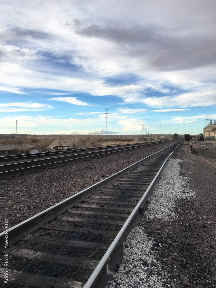 Beautiful sky over railroad tracks in California suburb