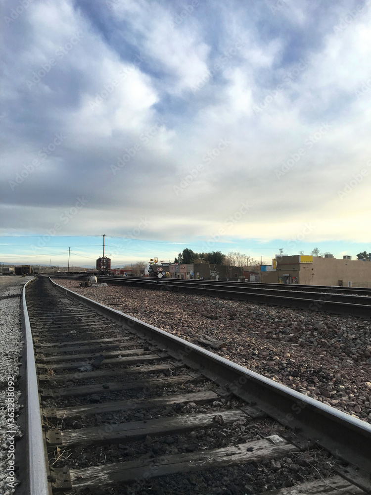 Beautiful sky over railroad tracks in California suburb