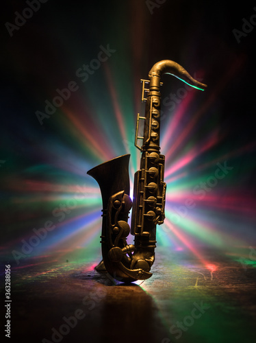 Obraz na płótnie Alto gold sax miniature with colorful toned light on foggy background