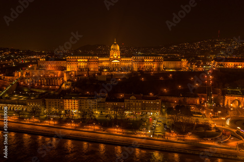Aerial drone shot of Buda castle on Buda Hill in Budapest night with city lights on © Davidzfr