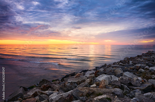 Baltic Sea rocky coast at sunset, Mrzezyno, Poland.
