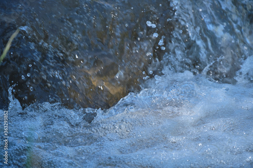 raging mountain river around the stones