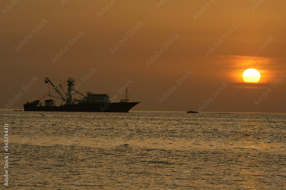 fishing boat in the caribbean in the late afternoon
