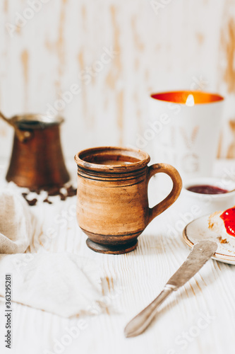 Fototapeta Naklejka Na Ścianę i Meble -  Coffee, toast and jam on a white wooden table
