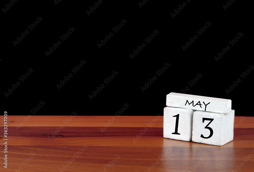 13 May calendar month. 13 days of the month. Reflected calendar on wooden floor with black background 13 May calendar month. 13 days of the month. Reflected calendar on wooden floor with black background