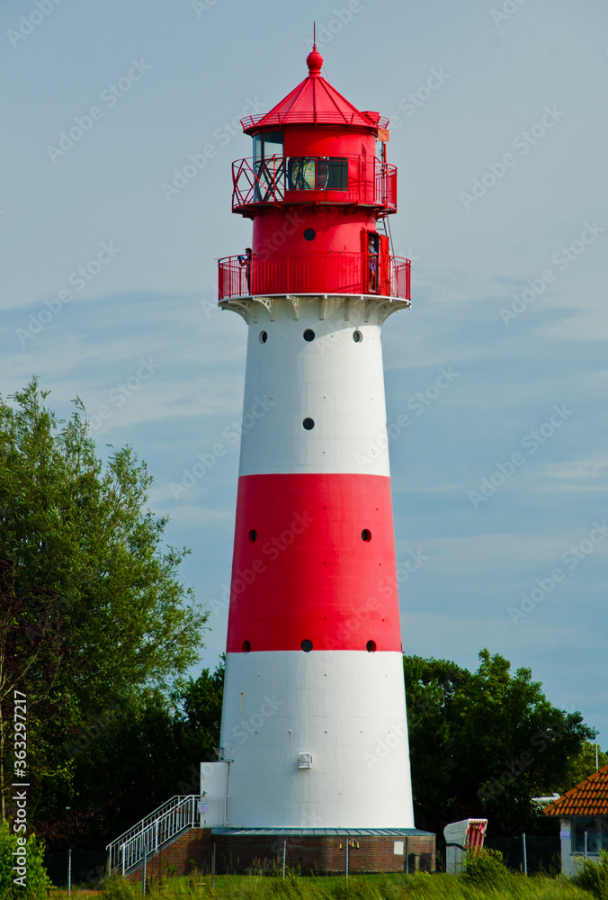 A small and beautiful lighthouse in daylight in Falshöft, Germany