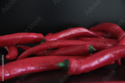 colorful peppers on a black background 