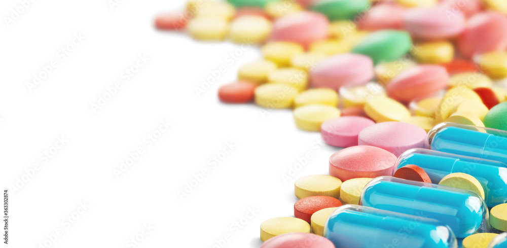 pile of medical pills on white background with place for text. Pattern for design. pile of medical pills on white background with place for text. Pattern for design.