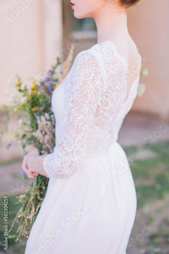 Bride in a white dress before the engagement ceremony