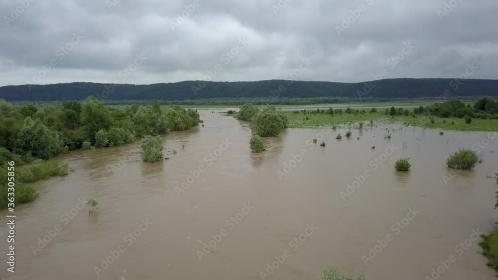 Aerial view flooded road heavy rain flooding taken during drone flight overflowing river storm water, danger wet disaster damage grass, climate lake high stream season environmental ecology rural Aerial view flooded road heavy rain flooding taken during drone flight overflowing river storm water, danger wet disaster damage grass, climate lake high stream season environmental ecology rural