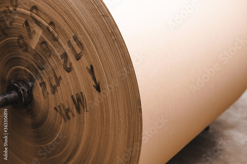 Big Stack of Printing Paper Rolls in Warehouse. The concept of production of paper and paperboard. Industry, copy space.