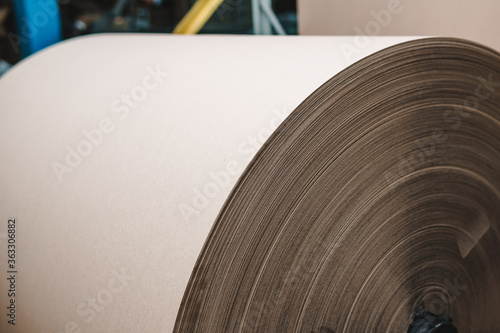 Big Stack of Printing Paper Rolls in Warehouse. The concept of production of paper and paperboard. Industry, copy space.