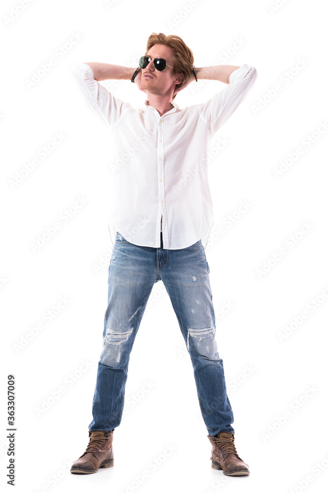 Calm serene confident satisfied fashionable man looking up with hands behind head. Full body length isolated on white background. Calm serene confident satisfied fashionable man looking up with hands behind head. Full body length isolated on white background.