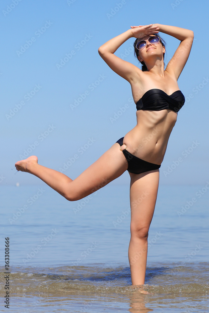 young girl in bikini against the sea young girl in bikini against the sea