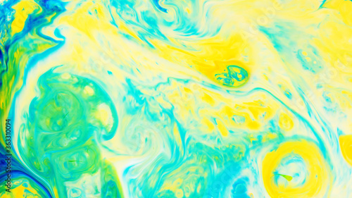 Fluid Art. Abstract blurred colorful background. Swirl liquid pattern. Marble effect of green color. Trendy colorful backdrop