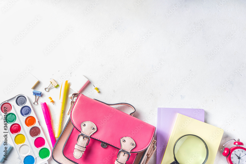 Back to school, education background. Back to School White Background with School Bag Backpack, Notebook, Pen, Pencil, Pencils, Magnifying Glass, Eraser, Paper Clip, Alarm Clock, School Supplies